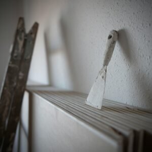 a pair of skis leaning against a white wall